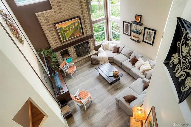 2061 Chesapeake Pl, Highlands Ranch, CO 80126 - living room featuring a fireplace and wood finished floors