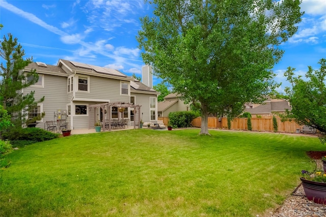 2061 Chesapeake Pl, Highlands Ranch, CO 80126 - back of house featuring a patio, solar panels, a chimney, a fenced backyard, and a pergola