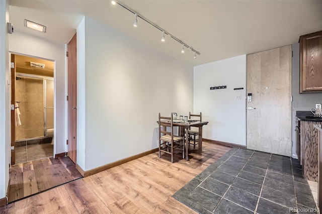 dining area with dark hardwood / wood-style floors