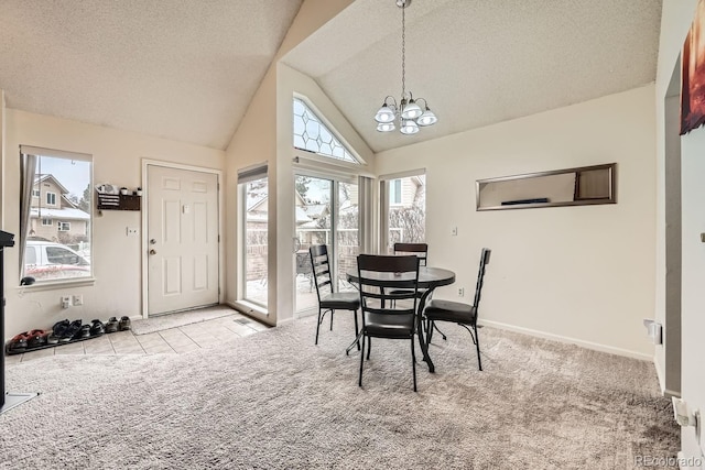 tiled dining space with carpet floors, an inviting chandelier, a textured ceiling, high vaulted ceiling, and baseboards