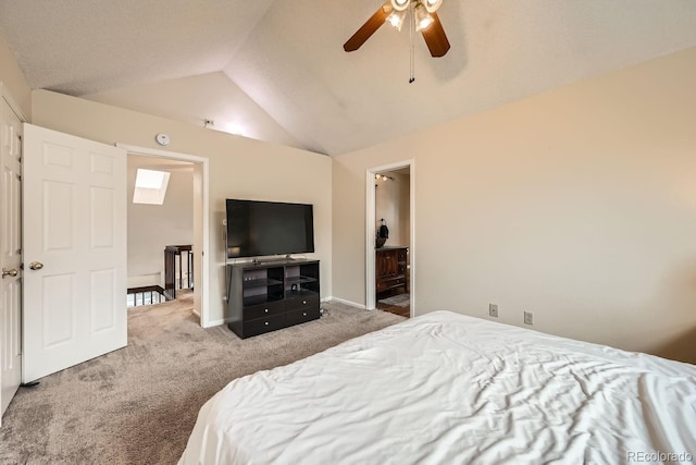 carpeted bedroom with vaulted ceiling, a ceiling fan, and baseboards