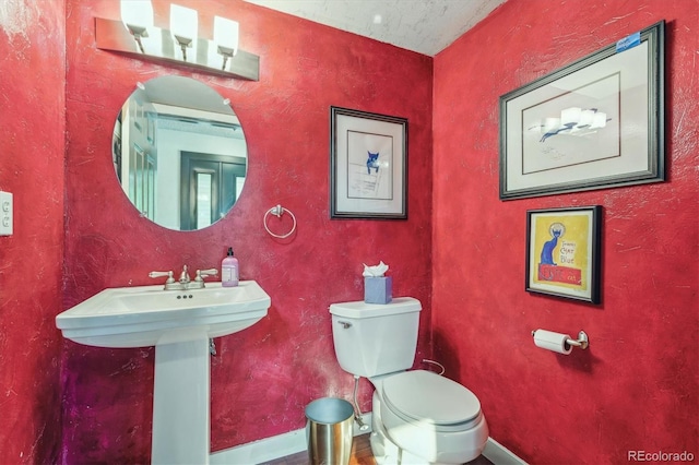 bathroom with sink and toilet