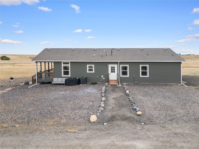 back of property featuring central AC unit