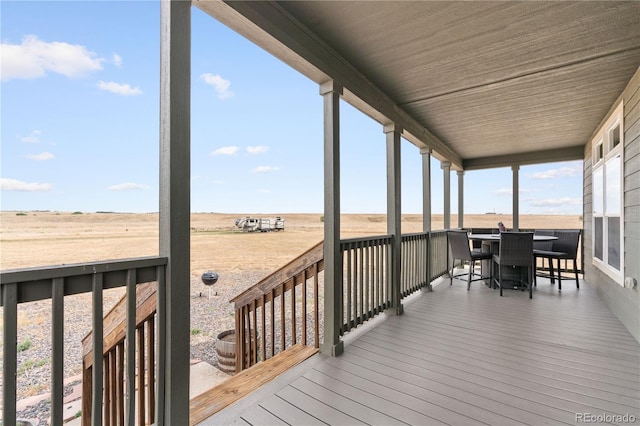 wooden deck featuring a rural view