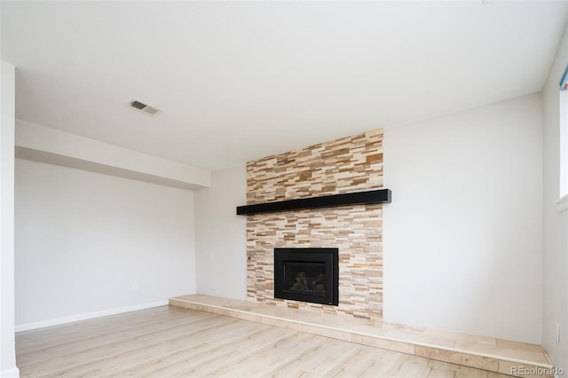 4760 S Wright Way, Morrison, CO 80465 - unfurnished living room with wood finished floors and a fireplace