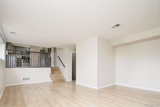 4760 S Wright Way, Morrison, CO 80465 - unfurnished room with light wood finished floors and stairway
