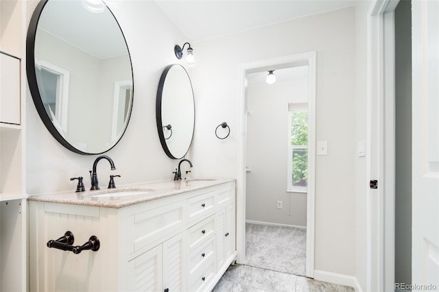 4760 S Wright Way, Morrison, CO 80465 - bathroom with double vanity and baseboards
