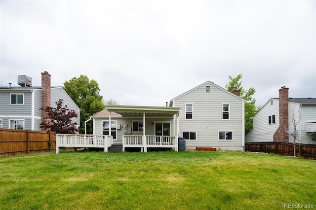 4760 S Wright Way, Morrison, CO 80465 - rear view of house with a fenced backyard and a wooden deck