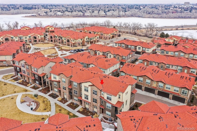 snowy aerial view with a residential view