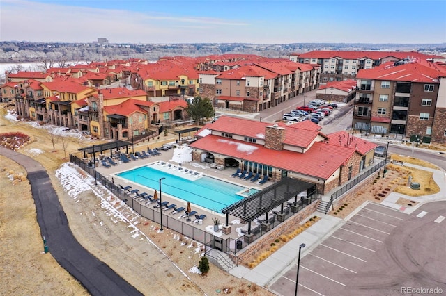 community pool with a residential view