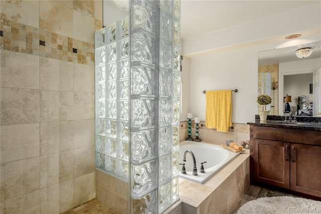 20182 E Maplewood Pl, Centennial, CO 80016 - bathroom featuring a bath, vanity, and walk in shower