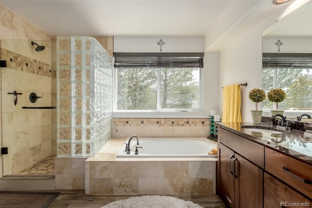20182 E Maplewood Pl, Centennial, CO 80016 - bathroom with a garden tub, tiled shower, and vanity