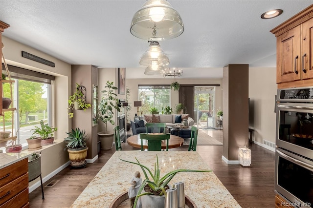 20182 E Maplewood Pl, Centennial, CO 80016 - dining area featuring plenty of natural light, dark wood finished floors, baseboards, and recessed lighting
