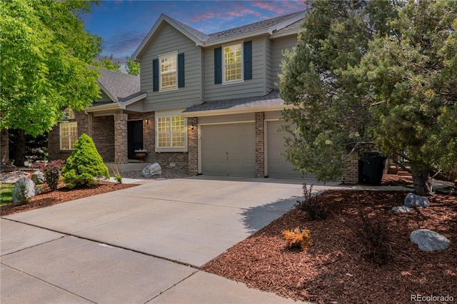 20182 E Maplewood Pl, Centennial, CO 80016 - view of front of property with driveway, brick siding, roof with shingles, and an attached garage
