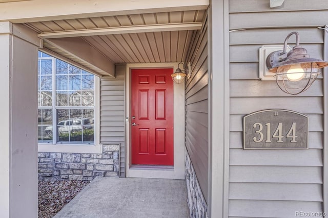 view of exterior entry with stone siding