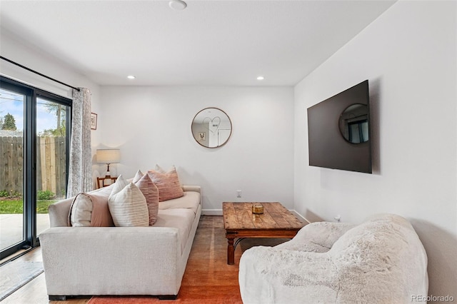 living area with recessed lighting and wood finished floors