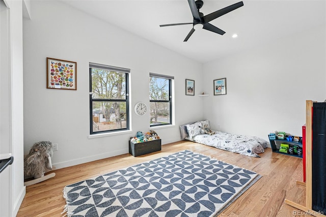 bedroom with light wood finished floors, recessed lighting, ceiling fan, and baseboards