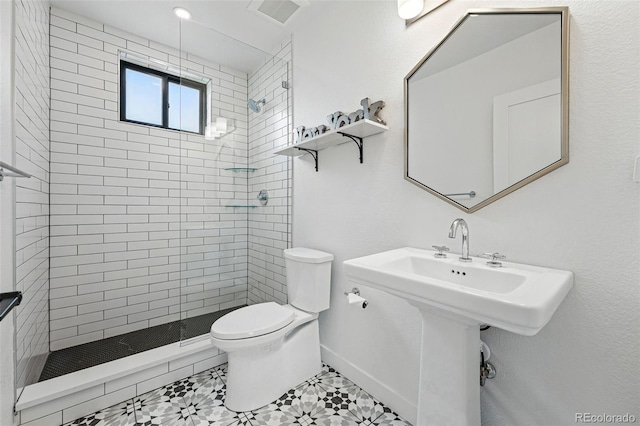 full bath with a stall shower and toilet
