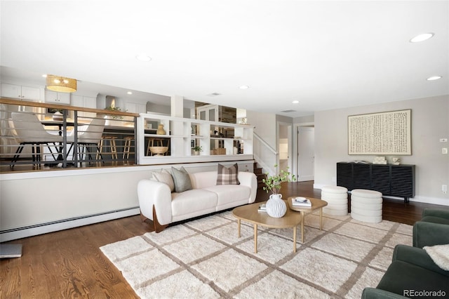 5586 Colorow Dr, Morrison, CO 80465 - living room featuring wood finished floors, a baseboard radiator, stairs, and recessed lighting