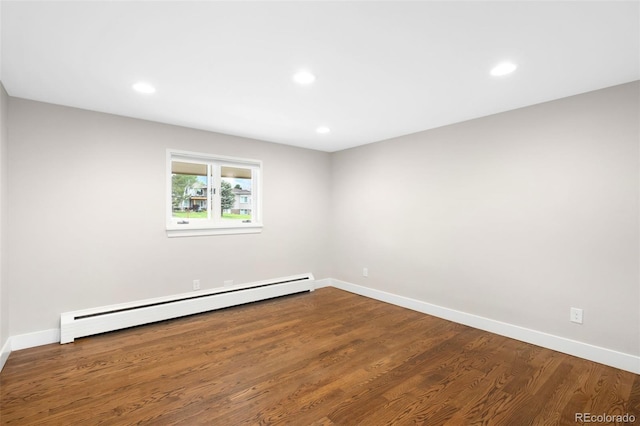 5586 Colorow Dr, Morrison, CO 80465 - unfurnished room with baseboard heating, baseboards, wood finished floors, and recessed lighting