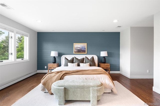 5586 Colorow Dr, Morrison, CO 80465 - bedroom with baseboards, baseboard heating, recessed lighting, and wood finished floors