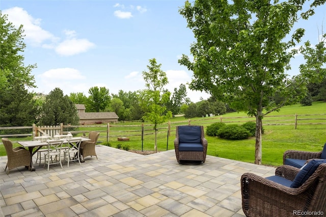 5586 Colorow Dr, Morrison, CO 80465 - view of patio / terrace featuring outdoor dining space and view of scattered trees