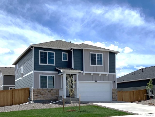 view of front of home with a garage and a front yard