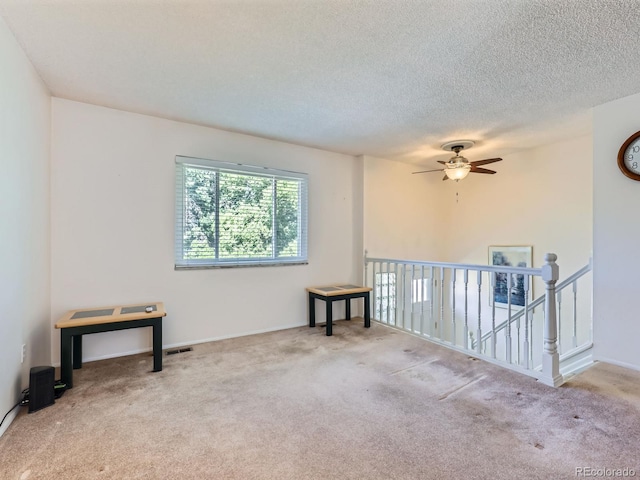 1576 S Ursula Ct, Aurora, CO 80012 - unfurnished room with carpet, a ceiling fan, and a textured ceiling