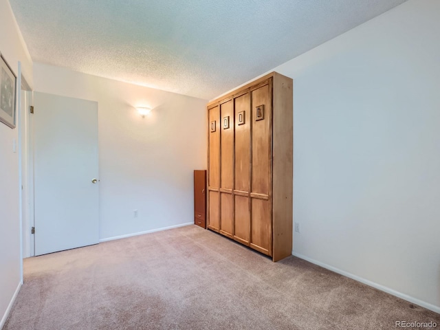 1576 S Ursula Ct, Aurora, CO 80012 - unfurnished bedroom with light carpet and a textured ceiling