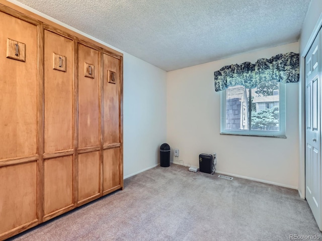 1576 S Ursula Ct, Aurora, CO 80012 - unfurnished bedroom featuring carpet flooring and a textured ceiling
