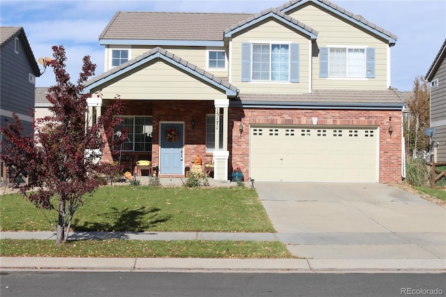 craftsman house with a front yard and a garage