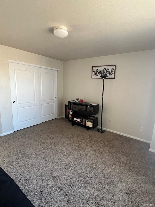 bedroom featuring a closet and carpet