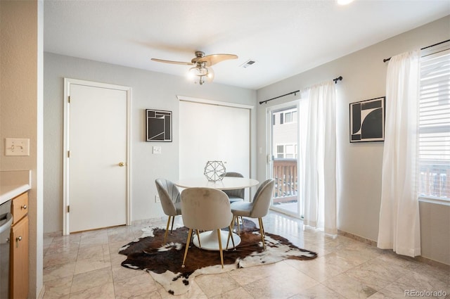 dining area with ceiling fan