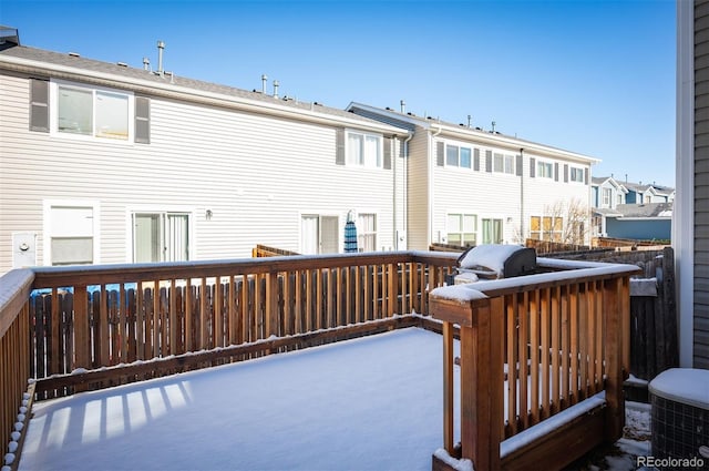 deck with a grill and central AC