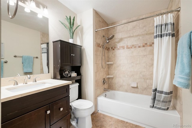 full bathroom featuring tile patterned flooring, shower / bath combination with curtain, vanity, and toilet