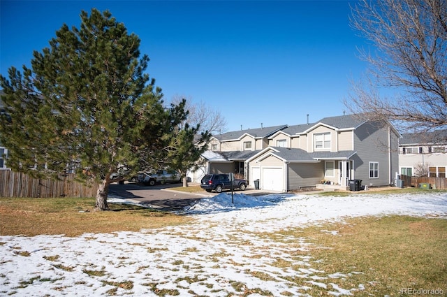 view of front of home featuring a yard and a garage