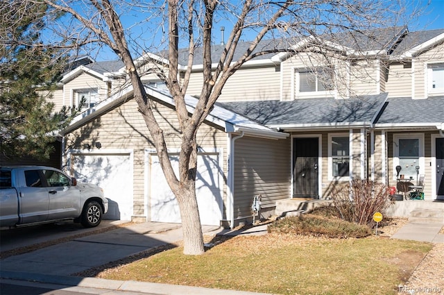 view of front of house featuring a garage and a front lawn