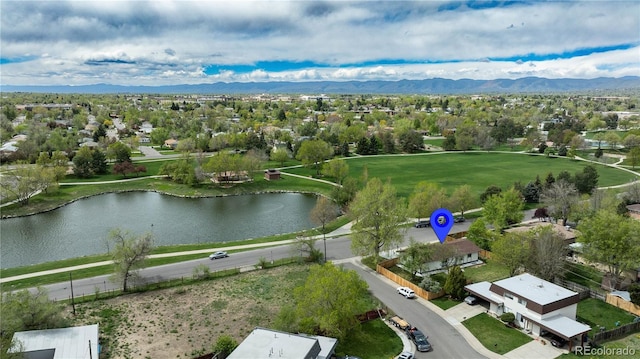 birds eye view of property featuring a water and mountain view