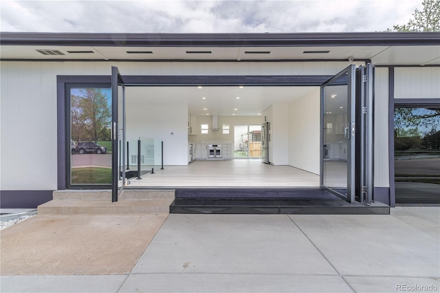 doorway to property with visible vents