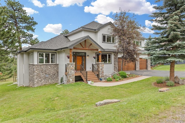 1474 Belford Ct, Evergreen, CO 80439 - view of front facade with stone siding, a garage, driveway, and a front lawn