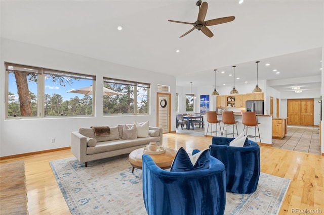 1474 Belford Ct, Evergreen, CO 80439 - living room with vaulted ceiling, a ceiling fan, light wood-style flooring, and recessed lighting
