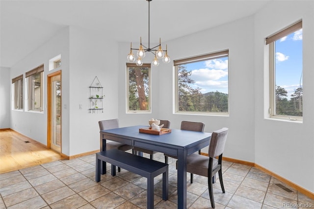 1474 Belford Ct, Evergreen, CO 80439 - dining room featuring healthy amount of natural light and a chandelier
