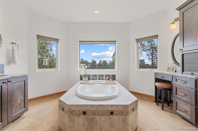 1474 Belford Ct, Evergreen, CO 80439 - bathroom with plenty of natural light, a garden tub, and vanity
