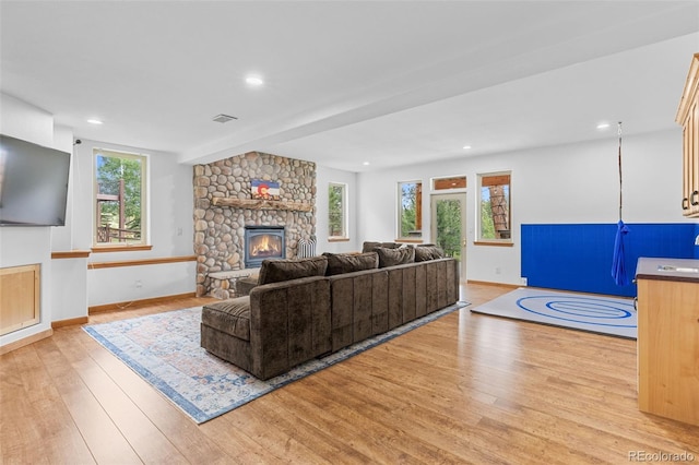1474 Belford Ct, Evergreen, CO 80439 - living area featuring light wood finished floors, a fireplace, and recessed lighting