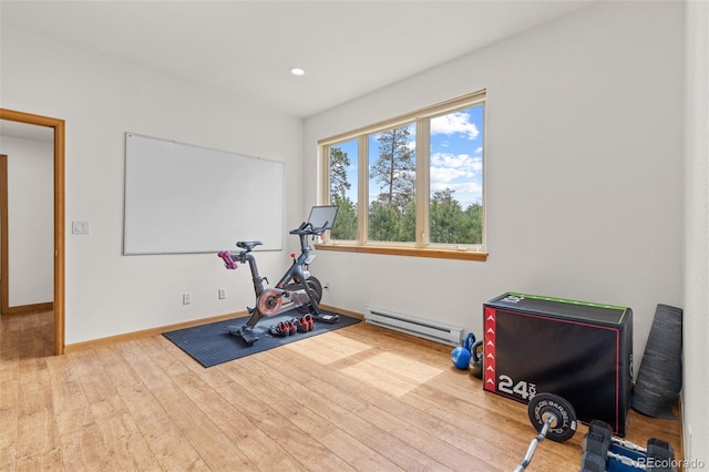 1474 Belford Ct, Evergreen, CO 80439 - exercise area featuring a baseboard radiator, hardwood / wood-style flooring, and recessed lighting