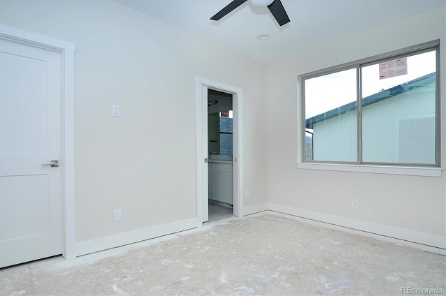 unfurnished bedroom with ensuite bathroom and ceiling fan