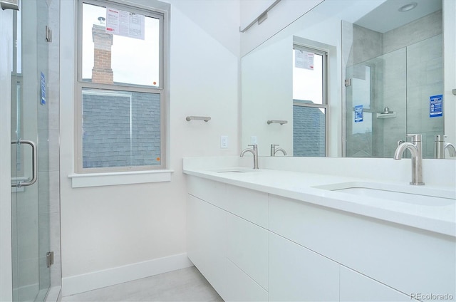 bathroom featuring vanity and an enclosed shower