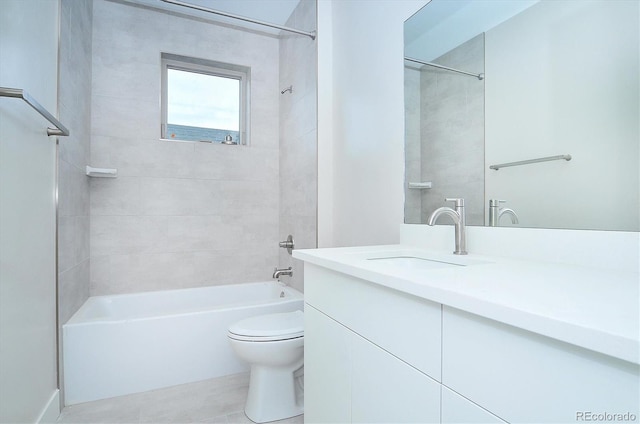 full bathroom with tiled shower / bath combo, toilet, and vanity