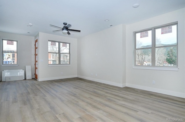 interior space with ceiling fan and light hardwood / wood-style floors