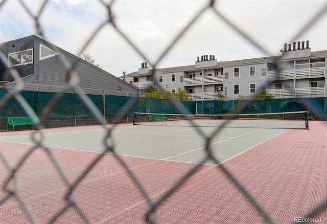 view of sport court with fence